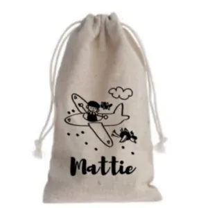 Pepernotenzakje zwarte piet strooit uit vliegtuig